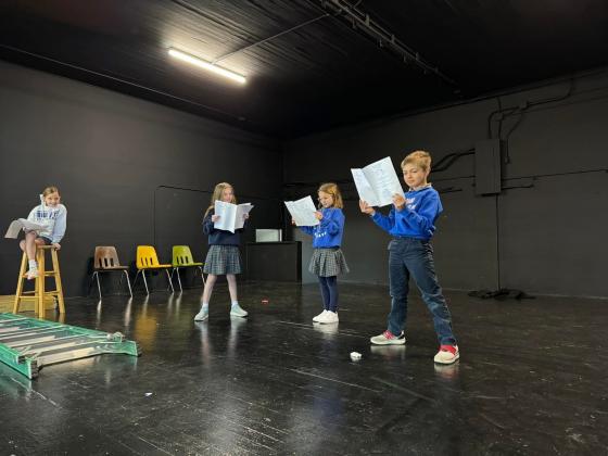 Brittany’s Comeaux’s third grade students at St. Edmund Elementary are reading a drama play during reading class. Each student got a script featuring their own character. They took to the freshly renovated stage in the old gym to bring the story to life. From left are Cyda Hare, Adeline Wimberly, Clare Fruge and Kolt McGee. (Submitted photo)