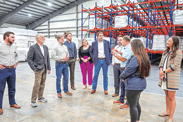 Bobby  Hanks, third from right, owner of Supreme Rice,  speaks to a delegation of state officials participating in an economic tour of Acadia Parish recently. From left are, Rep. Chance Henry; Sen. Bob Hensgens; Danny Nugier, vice president of operations, Supreme Rice; Paul Hundley, assistant to Rep. Phillip DeVillier; Taylor Henry, director of business development and events, Acadia Parish Chamber of Commerce and Economic Development; Rep. Ryan Bourriaque; Speaker of the Louisiana House of Representatives