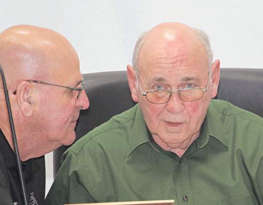 St. Landry Parish Council members, from left, Timmy Lejeune and Ernest Blanchard before Wednesday’s meeting in Opelousas. (Photo by Harlan Kirgan)