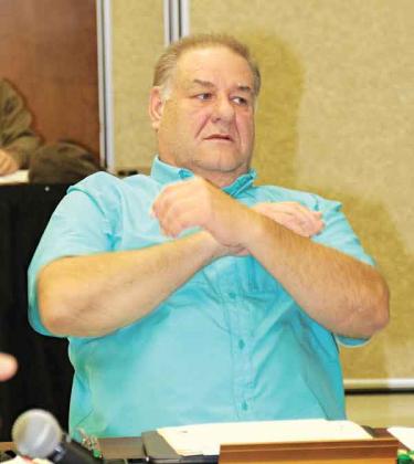 Kyle Boss, a St. Landry Parish School Board member, looks toward Superintendent Patrick Jenkins during a discussion about job descriptions at a committee meeting on Tuesday. (Photo by Harlan Kirgan)