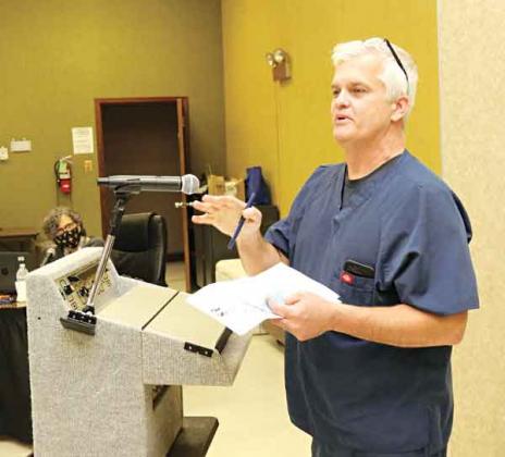 Dr. Robert Turk, of Eunice, talks about St. Landry Parish School district’s mask requirement at a meeting on Monday. (Photo by Harlan Kirgan)