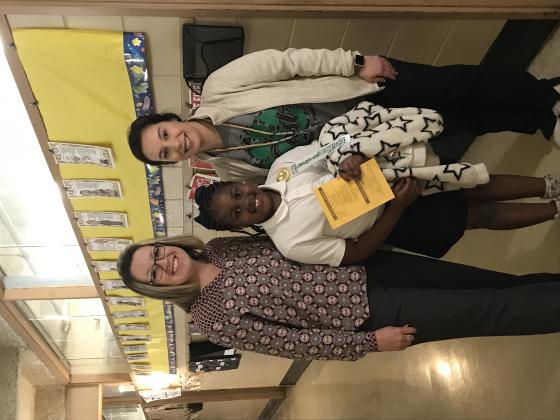 Haley Feucht, second grade teacher, is with Rhylee Vallare. Vallare was presented with an AR award. Her principal Gina LaGrange is at left.
