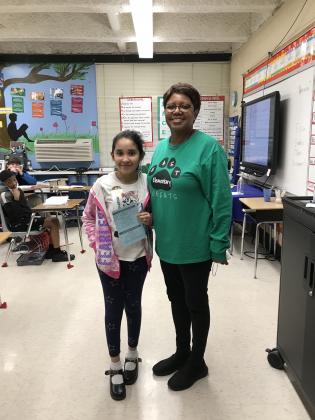 At right are Naomi Huerto Ordaz, a fourth grader, with his teacher Annetta Papillion.