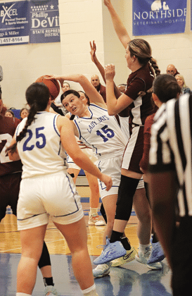 St. Edmund’s Kennedy Dubroc twists to avoid a Covenant Christian Lady Lions player. (Photo by Amy Myers)