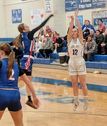 St. Edmund basketball player Caroline Lavergne fires a shot in the first quarter of the Monday 65-60 playoff loss to St. Mary’s. (Photo by Sports Editor Rhett Manuel)