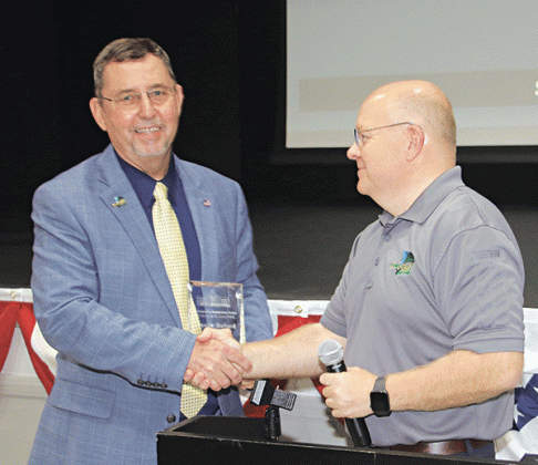 St. Landry Parish President Jessie Bellard, left, received a special Leadership Award from the Parish Council. Van  Reed, a member of parish government’s executive team presented the award.
