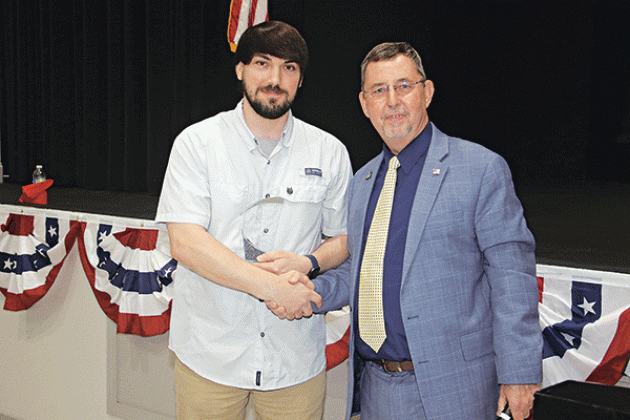 Seth Robin, left, owner of Benny’s Big Star grocery in Opelousas, received the President’s award from Parish President Jessie Bellard.