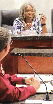 St. Landry Parish Council member Nancy Carriere questions Parish President Jessie Bellard about moving the Confederate monument off the courthouse square. (Photo by Harlan Kirgan)
