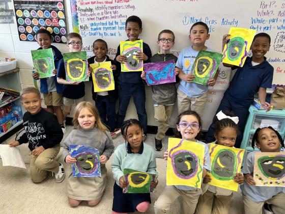 First grade students at East Elementary painted the traditional screen masks.