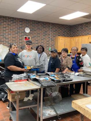 From left are Bernita Ned, Angela King, Veronica Lee, Karen Ardoin, Lena Ledet, Jean Celestine and Philomena Bernard. Not pictured is Marjorie Eaglin and Dot Fruge.  Working the door for tickets were Lee Edwards and Sandra Wilkins. Men frying fish included David Bushnell, Mike Bellow, Charles Brcy Jr., Mike Brcy, Carrol Bushnell and Joseph Bernard. (Photo by Myra Miller)