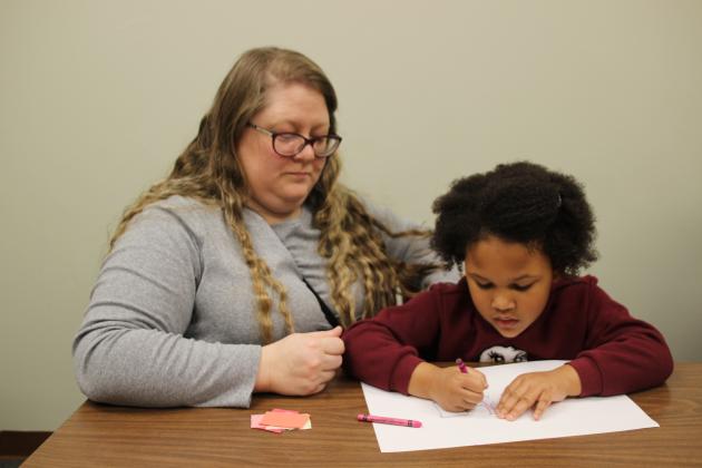 Courtney Bergeaux and Skyla Bergeaux crafting at the library