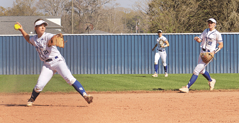 Kourtney Lavergne fielding a ball to make the out at first in a 7-6 win over South Beauregard. (Photos by Amy Myers)