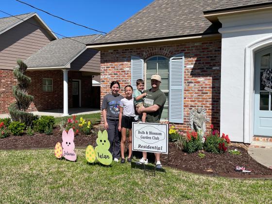 The Residential Garden of the Month marker given by the Bulb &amp; Blossom Garden Club went to the Prudhommes. Their home is located at 1350 College Road and features  snap dragons, foxtail fern, variegated flax lily, boxwood, shi shi, and spiral junipers. From left, are Emily, Juilanna, Talan and Sage Prudhomme. (Submitted photos)