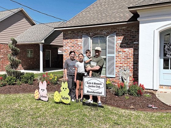 The Residential Garden of the Month marker given by the Bulb &amp; Blossom Garden Club went to the Prudhommes. Their home is located at 1350 College Road and features  snap dragons, foxtail fern, variegated flax lily, boxwood, shi shi, and spiral junipers. From left, are Emily, Juilanna, Talan and Sage Prudhomme.