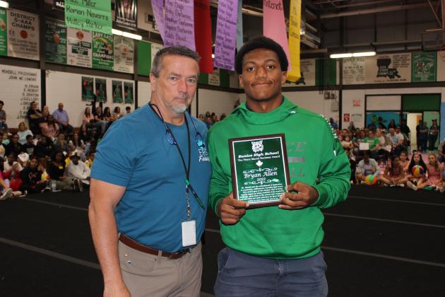 Bryan Allen, a junior, was the recipient of the Pierre Martel Rockstar Award. He is with principal Mitchell Fontenot.