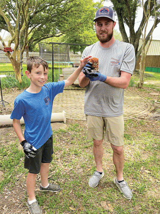 Winston, 7, is pictured with his dad, Lyle. Guidry  is an agriculture teacher at Midland High School.