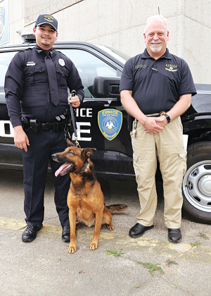The Town of Mamou donated a police dog to the Eunice Police Department. The K9, named Amos, arrived Tuesday. With Amos, from left, are his new handler, Patrol Officer Keith Peters, and Police Chief Kyle LeBouef outside the Eunice Municipal Complex on Thursday afternoon. (Photo by Harlan Kirgan)