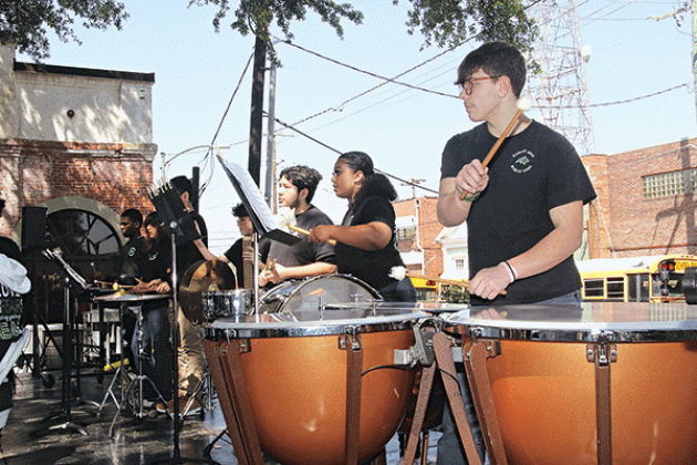 Ty Vidrine plays the timpani during the Eunice High Band performance on Saturday.