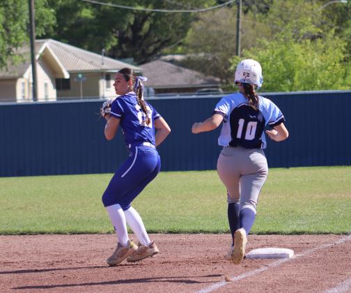 The St. Edmund Lady Jays won their second district game of the week on March 19 sending Westminster of Opelousas home after 4 innings. The Jays won 15-0. Pictured is Aubrie LeJeune looking to the next play after making the out at first. (Photo by Amy Myers)