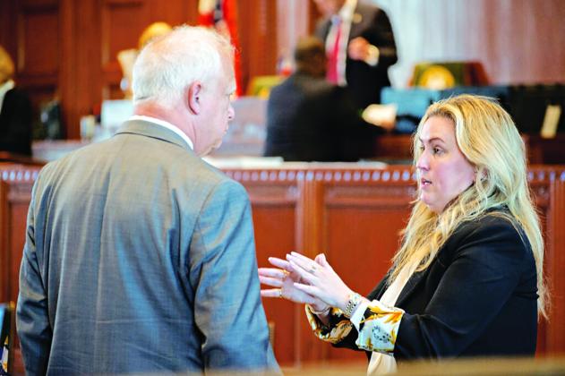 Rep. Julie Emerson, R-Carencro, speaking to Rep. Charles Owen in the House Chamber. (Allison Allsop/ Louisiana Illuminator)