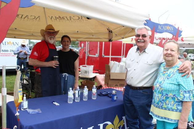 Acadian Medical Center had a cooking booth Sunday during the Crawfish Etouffee Cook-Off. Tony Johnson and Julie Paul with AMC wait on tasters and one was Patrick and Laurali Duplechain of Duralde.