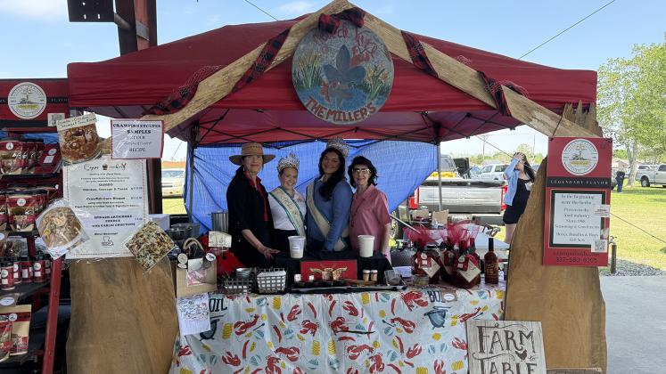 Cajun Prairie Signature Foods placed third in Crawfish Etouffee Cook-off Showmanship/Booth Decoration. From left are Myrna Miller, Teen Miss Eunice Gracie Lou Oliver, Miss Eunice Samantha Gobert and Joann Miller.