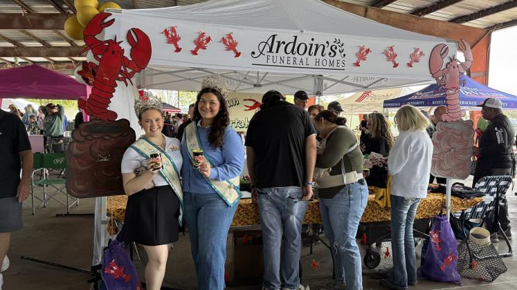 Ardoin’s Funeral Home placed second in Crawfish Etouffee Cook-off Showmanship/Booth Decoration. From left are Teen Miss Eunice Gracie Lou Oliver and Miss Eunice Samantha Gobert.