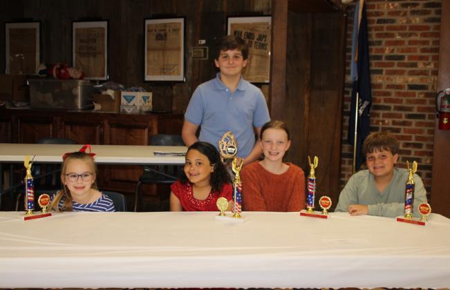 Americanism District winners were named. From left, are Allison Clark, Madison Guillory, Olivia Smith, and Cooper DeVillier. Standing is Davis Manuel who placed first in the Patriot’s Pen Essay contest. Cooper DeVillier also won second in the Americanism state contest.