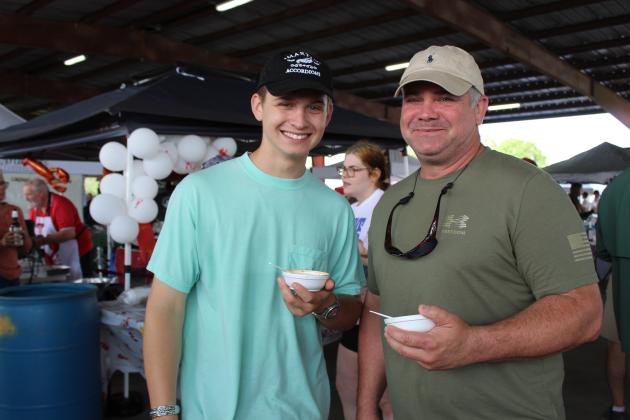 Kade Domec, left, and Jason Domec of Arnaudville enjoyed tasting crawfish etouffee Saturday at the annual Crawfish Etouffee Cook-Off.