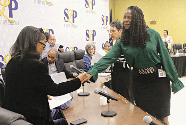 St. Landry Parish School Board finance director Shaun Grantham, right, announced at the April 4 School Board meeting she is leaving the school district, After the meeting she said she accepted the position of finance director for the Acadia Parish Police Jury effective April 29.