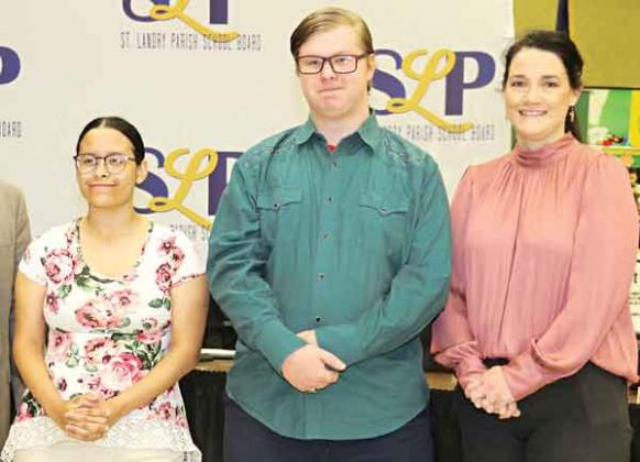 Two Eunice High School students, Baylie Guillory and Dylan Fuselier, were recognized at the St. Landry Parish School Board meeting Thursday. The students are the first in the state to earn dual enrollment technical college degrees. They attended the Eunice Career and Technical Educational Center and South Louisiana Community College where they earned degrees in Culinary Arts and Occupations. With them is Aimee Summerlin of the Eunice Career and Technical Educational Center. (Photo by