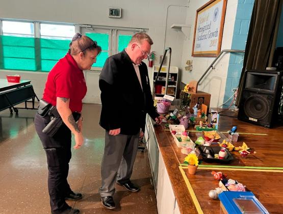 Highland held a Disguise the Egg Contest. The entries were judged by Deputy Chief Eddie Thibodeaux, Lt. Regina Rinaldi, and Sgt. Elizabeth Bernard from the St. Landry Parish Sheriff’s Office. Rinaldi and Thibodeaux take a close look at the entries. (Submitted photo)