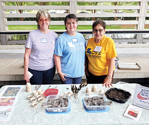 From left, Jean Johnson, Mona Redlich and Donna Baltakis, director of Keep Eunice Beautiful, attended Keep Louisiana Beautiful kickoff for Love the Boot Week in Baton Rouge. The trio displayed “seed balls,” a recycling/beautification project. Taking newspaper and water to make a pulp, then forming it into a ball, then rolling it into plant seeds. The ball can then be planted. This teaches recycling and gardening. Keep Eunice Beautiful will have its Love the Boot clean-up event Saturday. Volunteers can regis