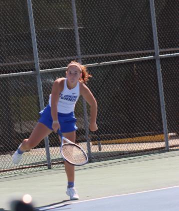 St. Edmund High hosted Sacred Heart Tuesday at the Fairgrounds tennis courts. Stella Summerlin is pictured serving and won her match 8-0. (Photo by Amy Myers)
