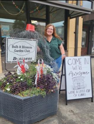 The Eunice Bulb &amp; Blossom Club chose as Business Garden of the Month recipient, Amelia Vidrine of Demitasse Artworks. The establishment, located at 225 South 2nd, features whimsical, garden containers filled with healthy, seasonal blooms encased in crawfish nets. The containers feature burgundy gaillardia, silver ragwort, shamrock pip Lucky Charm, Morning petunia, Seaside petunia, dianthus, decorative cabbage, Fox Tail fern, Asparagus fern, gerber daisy and Vampire Dahlias.