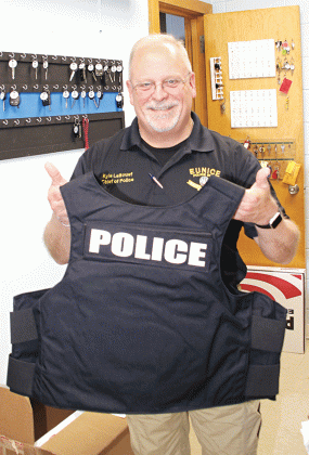 Eunice Police Chief Kyle LeBouef displays one of 15 armored vests the department received last week. (Photo by Harlan Kirgan)