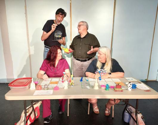 Rehearsing for the upcoming Eunice Players’ Theatre’s play ‘The Queen of Bingo’ are seated from left Stacy Prejean, and Ricci Arnaud. Standing, from left, are Shane Guilbeau and Kevin Miller. (Submitted photo)