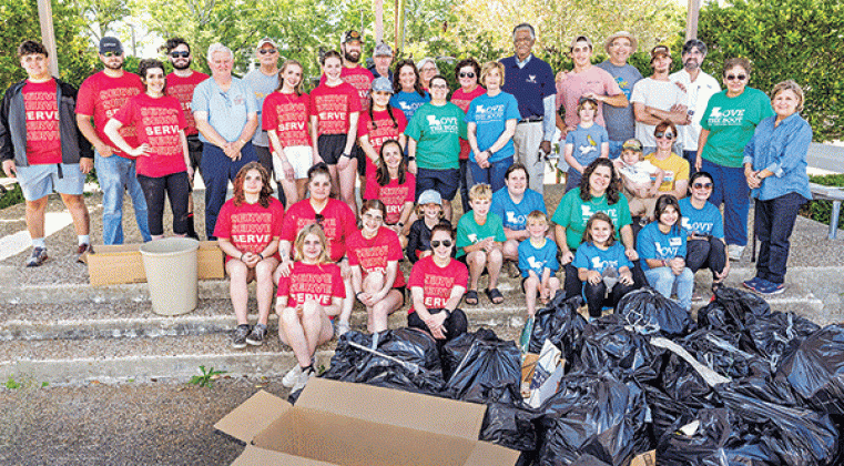 Volunteers fanned out across Eunice on Saturday for the Love the Boot cleanup organized by Keep Eunice Beautiful. Some of the volunteers are shown at the Eunice Municipal Complex with filled trash bags. Donna Baltakis, Keep Eunice Beautiful director, said the Eunice High Spirit Group and National Honor Society spent 3 hours and 48 students picked up 52 30-gallon bags last week. New Hope Fellowship spent 10 hours painting, planting and cleaning up elementary schools with 24 people. On Saturday, 62 people fil