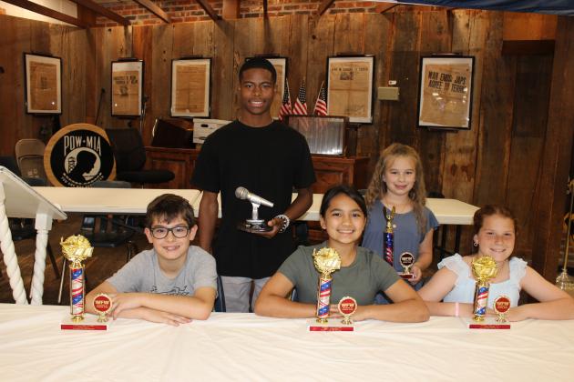 The VFW Post 8971 and Auxiliary honored students who placed in their annual Americanism essays contest. Students were awarded with cash prizes and trophies during a banquet. Seated, from left, are Jude Aucoin, Rory Langlinais and Mylie Trahan. In back, from left, are Dreylan B. Babino and Allison Clark. District winners are Allison Clark and Sloane Cart. Not pictured are Sloane Cart, Alyssa Myers, Cooper DeVillier, Kyra Davis and Aeryn Doucet.