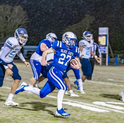 St. Edmund's Henry Summerlin scores on a touchdown run against WCA. (Photo by Dwight Jodon)
