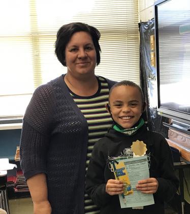 East Elementary third grade students in Brandy Rozas class has reached their 25-point goal in the AR program. Pictured with his teacher is Hayden Lee Joseph. (Submitted photo)