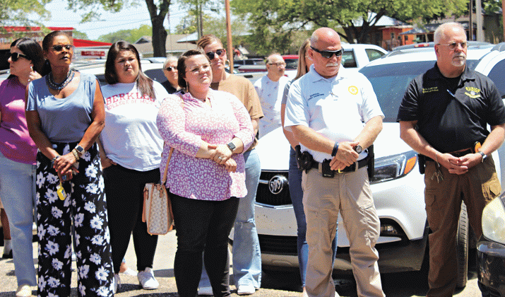 People gathered at the parking lot and pavilion of City Hall Thursday at noon for National Day of Prayer. In front, from left, are Angelia Guillory, Alison Duplechain, City Marshal Terry Darbonne and Eunice Police Chief Kyle LeBouef. More photos from the event are on Page 10. (Photo by Myra Miller)