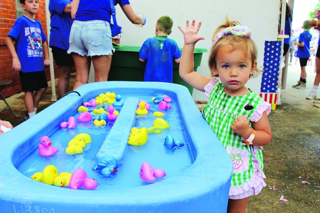 Nola Duthu, 2, is standing at the duck kid’s game. She is the daughter of Nick and Abbigail Duthu of Iota.