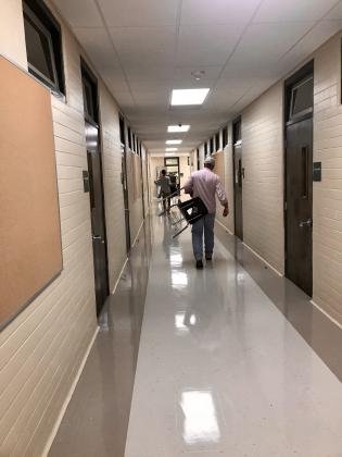 Moving desks into new classrooms at Eunice Elementary