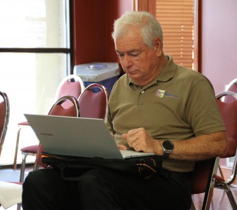 Demographer Mike Hefner at a St. Landry Parish Council meeting. (Photo by Harlan Kirgan)