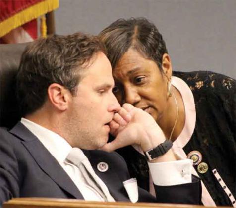 Reps. Tanner Magee, R-Houma, and C. Denise Marcelle, D-Baton Rouge, speak to one another during an April 7 meeting of the special House committee investigating the death of Ronald Greene in Louisiana State Police custody. (Photo by Greg LaRose/Louisiana Illuminator)