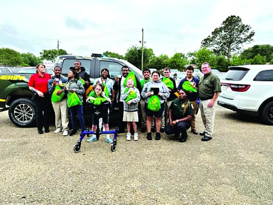 On Monday Deputy Chief Eddie Thibodeaux of the St. Landry Parish Sheriff’s Office, Lt. Chasity Carrier, School Resource Office, and Lt. Regina Rinaldi of DARE presented to Eunice High students with special needs a gift bag filled with a T-shirt and other fun items.