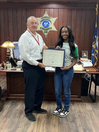 St. Landry Parish Sheriff Bobby Guidroz presents the Louiisiana Sheriff’s Scholarship to Eunice High senior Fajah Guillory. (Submitted photo)