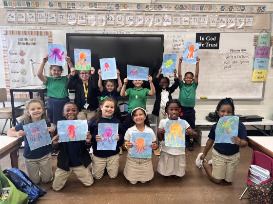 Acadiana Center for the Arts visited second grade classes at East Elementary and taught about layering, shapes, and texture while discussing and painting an eight legged octopus.
