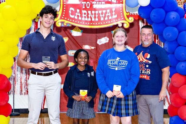 Students of the Year at St. Edmund are from left, Copeland Miller, Twelfth Grade Student of the Year; Fifth Grade Student of the Year Ava Ardoin, Eighth Grade Student of the Year Brylee Brown and Mitch Fontenot, principal.